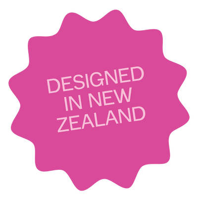 Pink star-shaped badge with 'Designed in New Zealand' text on a white background