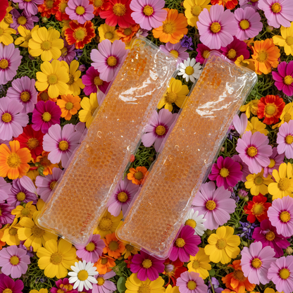 Two packages of a product on a colorful floral background